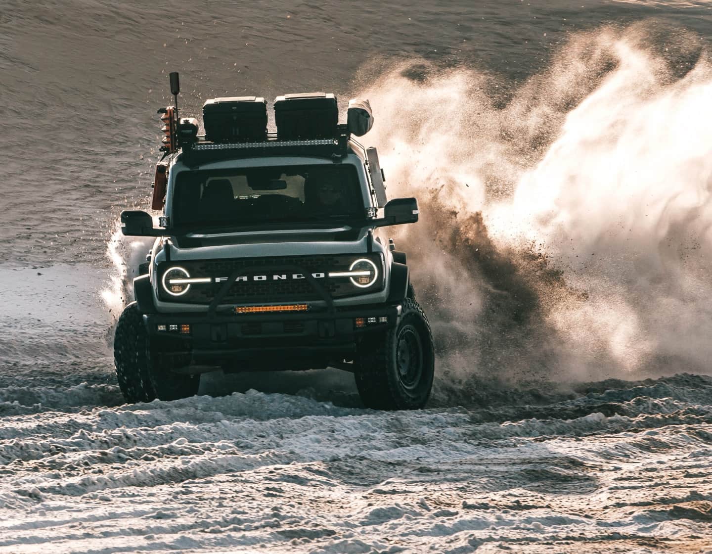 Overland vehicle kicking up dirt