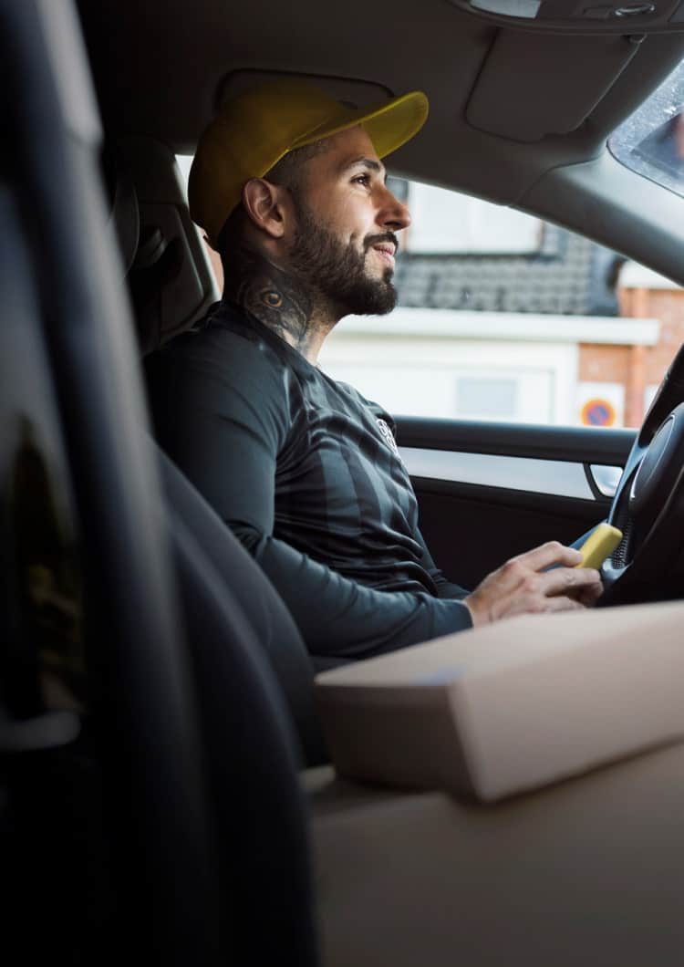 man using devices in vehicle