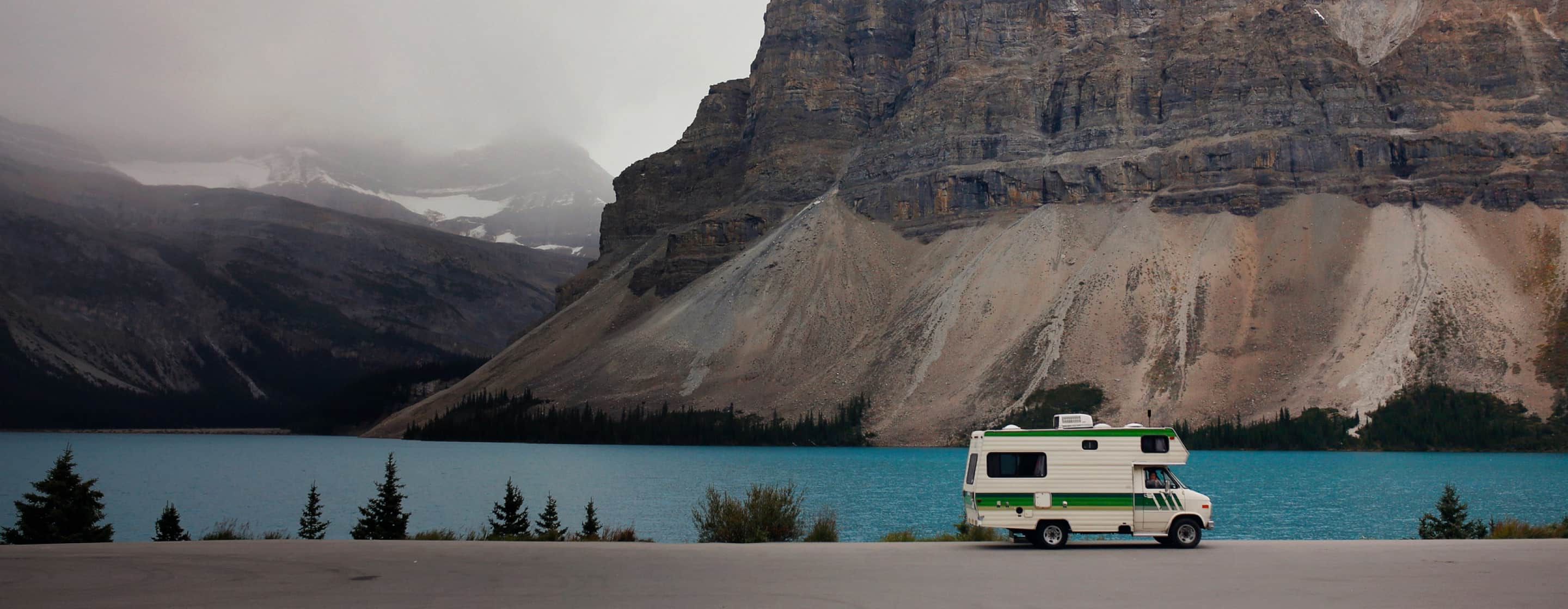 rv driving on lakeside road